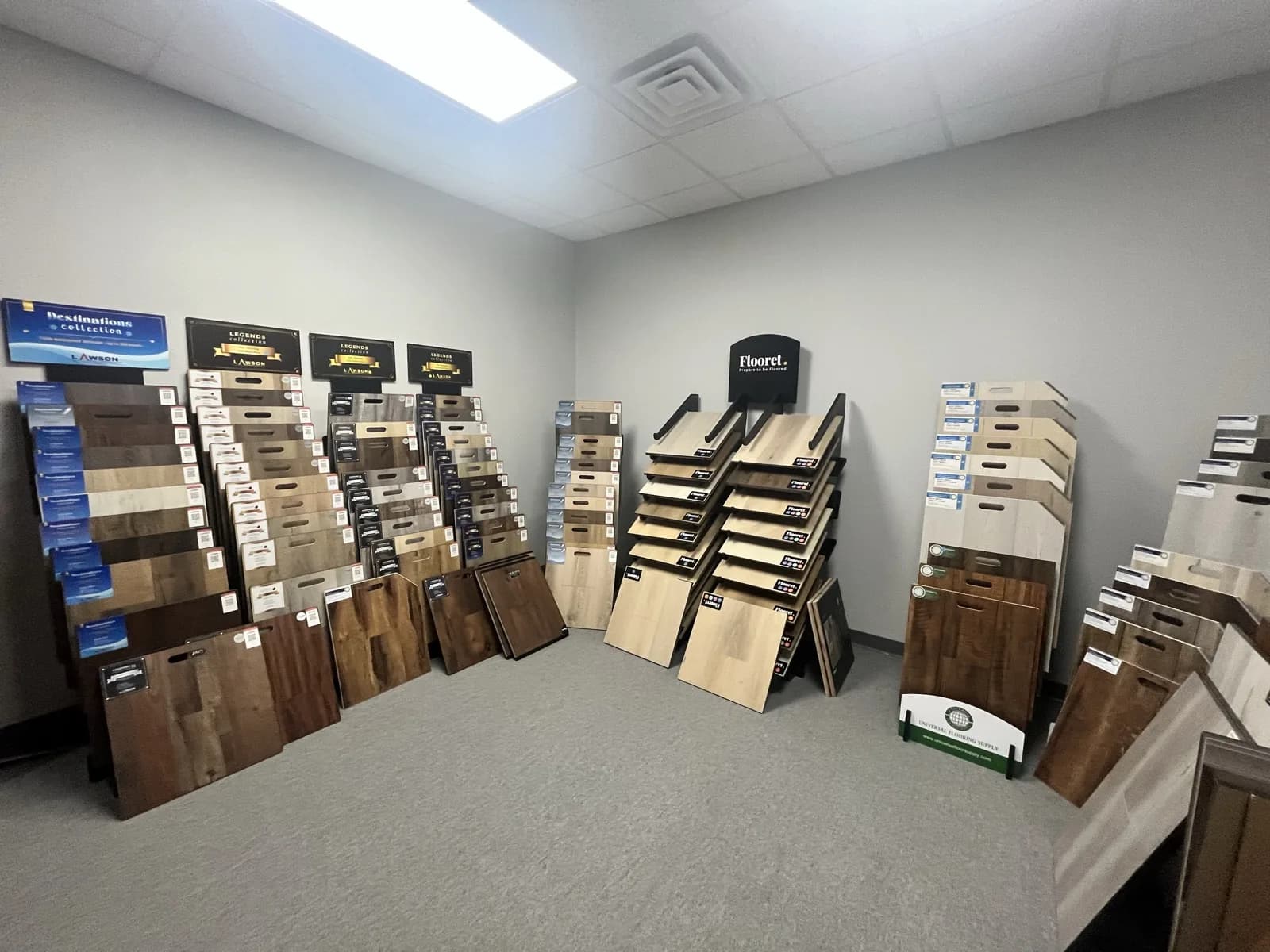 Luxury vinyl plank and laminate sample displays at the At Home Flooring showroom, Wylie TX