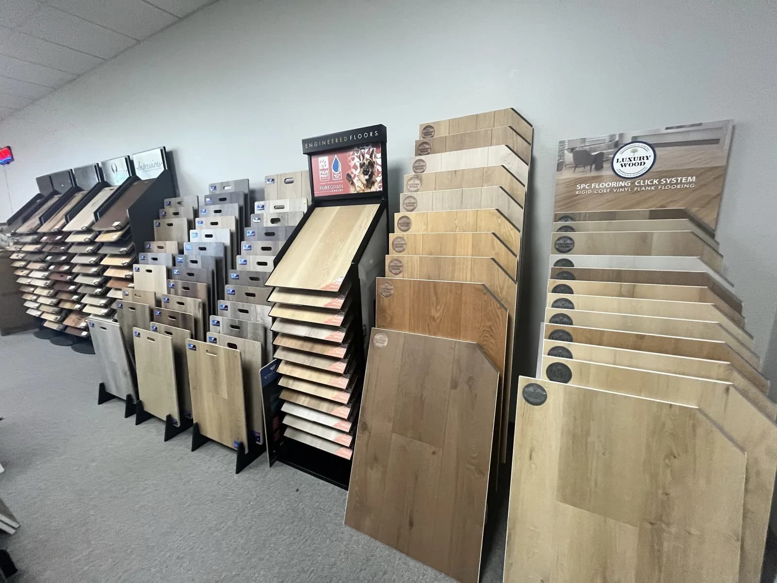 SPC click-system waterproof flooring displays at the At Home Flooring showroom, Wylie TX