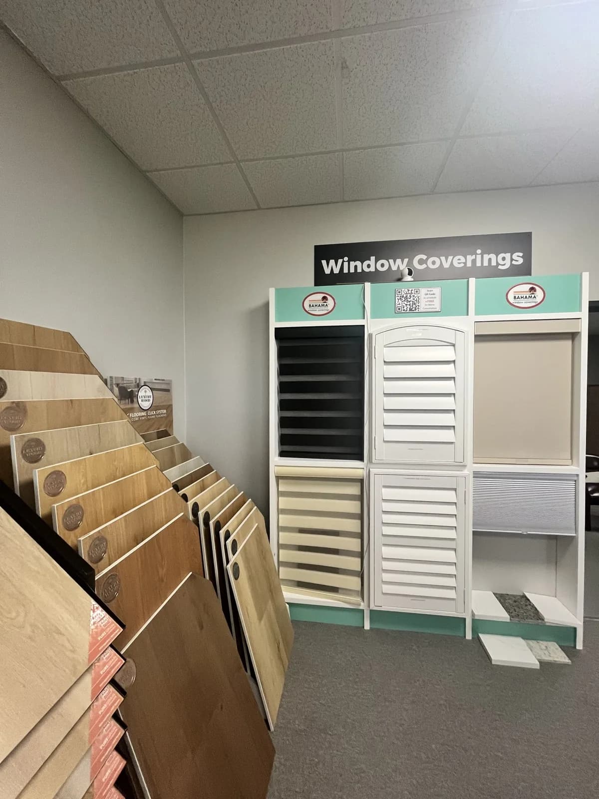 Window coverings display with shutter and blind samples at the At Home Flooring showroom, Wylie TX